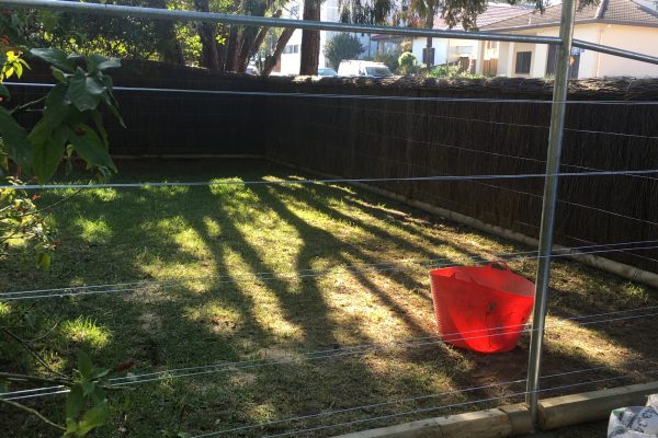 Brushwood fences, Galvanised Steel Posts and Cross Rail as a frame, a Treated Pine sleeper base, and Galvanised or PVC insulated Wire